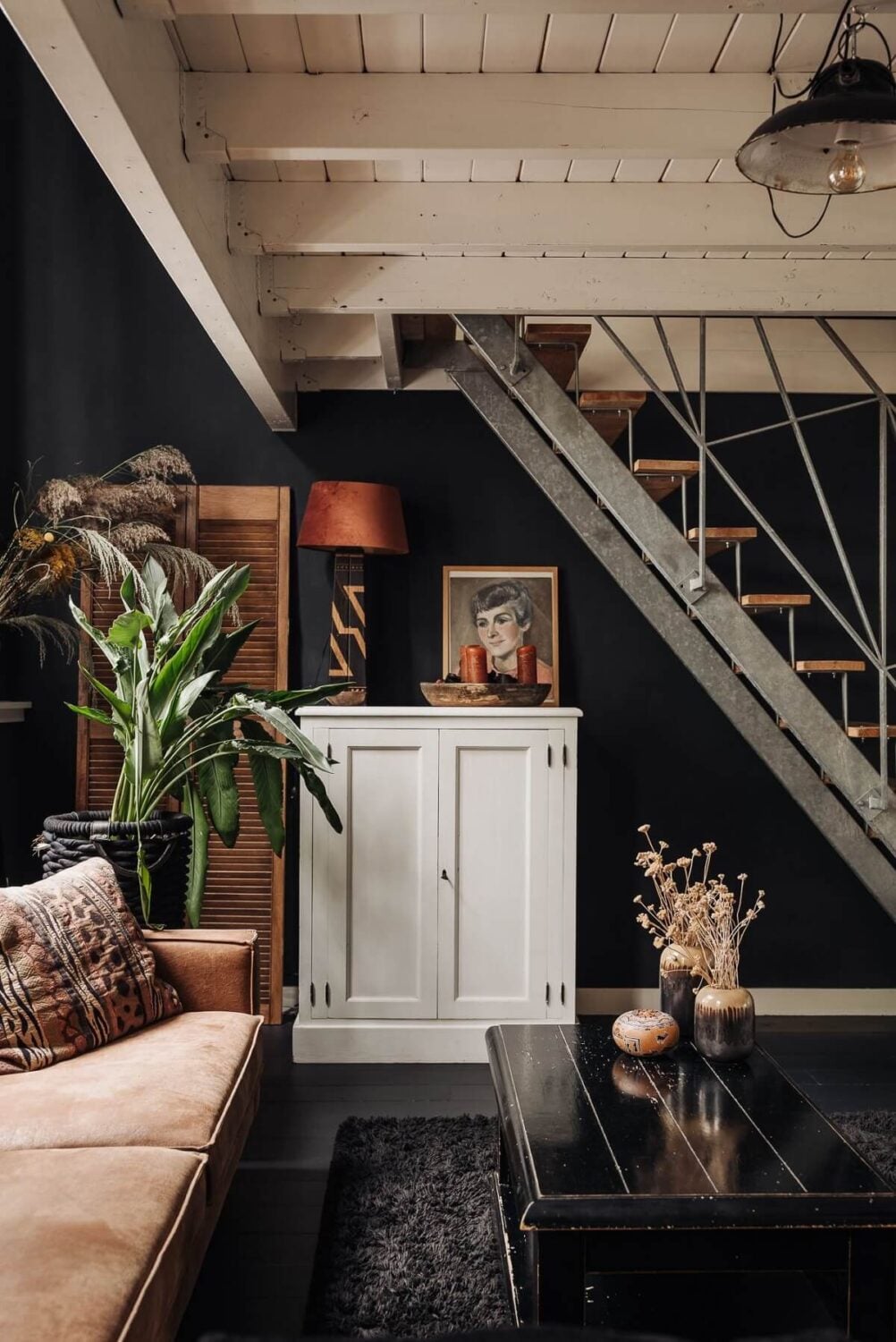 A Unique Black and White Home in a Former School Building 5 black-living-room-leather-sofa-nordroom