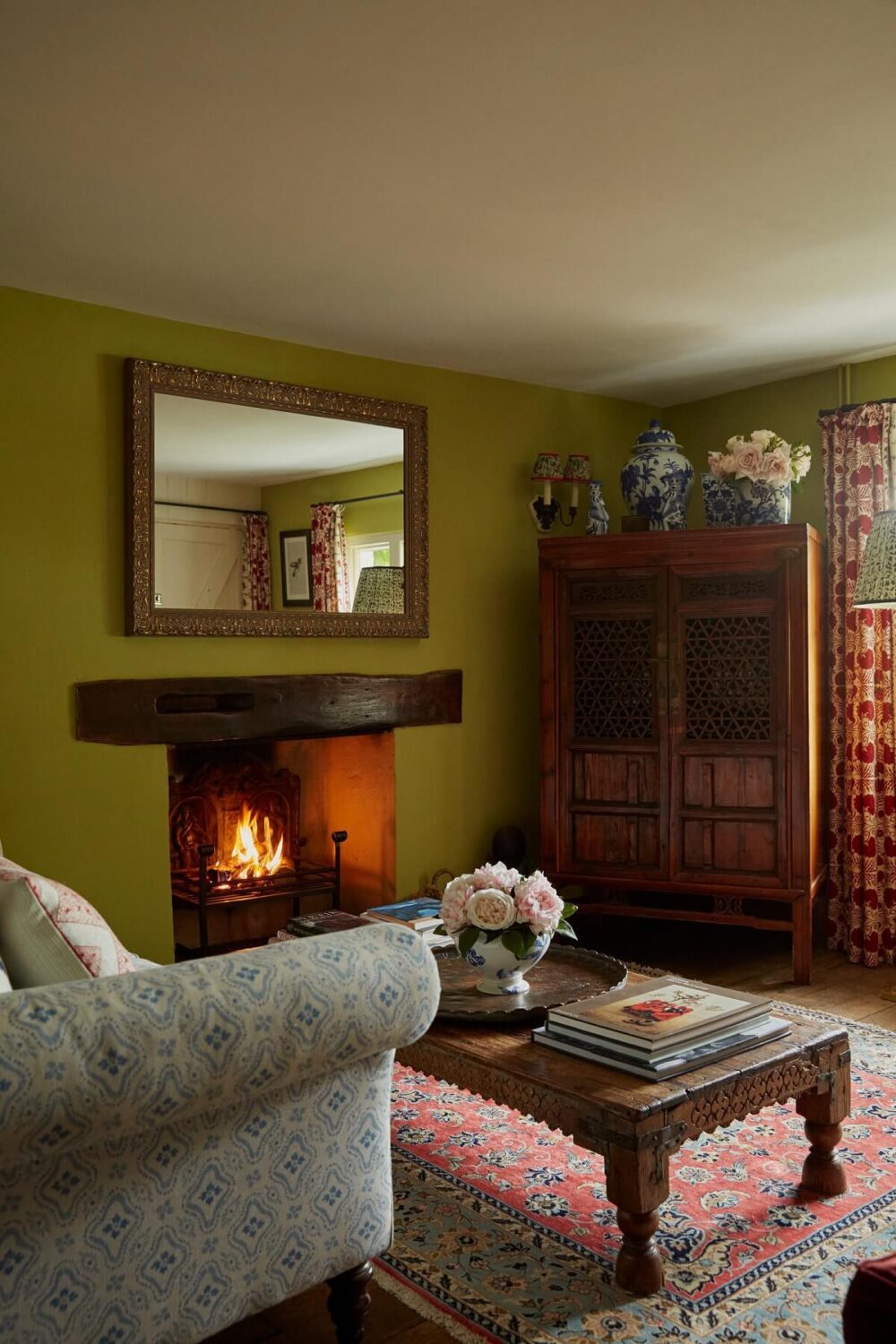 A Charming Arts and Crafts Cottage in the English Countryside 2 cottage-sitting-room-antique-furnishings-green-walls-fireplace-nordroom