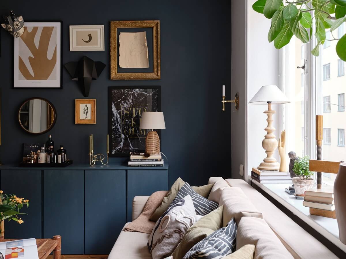 A Small Nordic Home with Dark Blue Accent Walls 3 dark-blue-accent-wall-ivar-cabinets-gallery-wall-nordroom