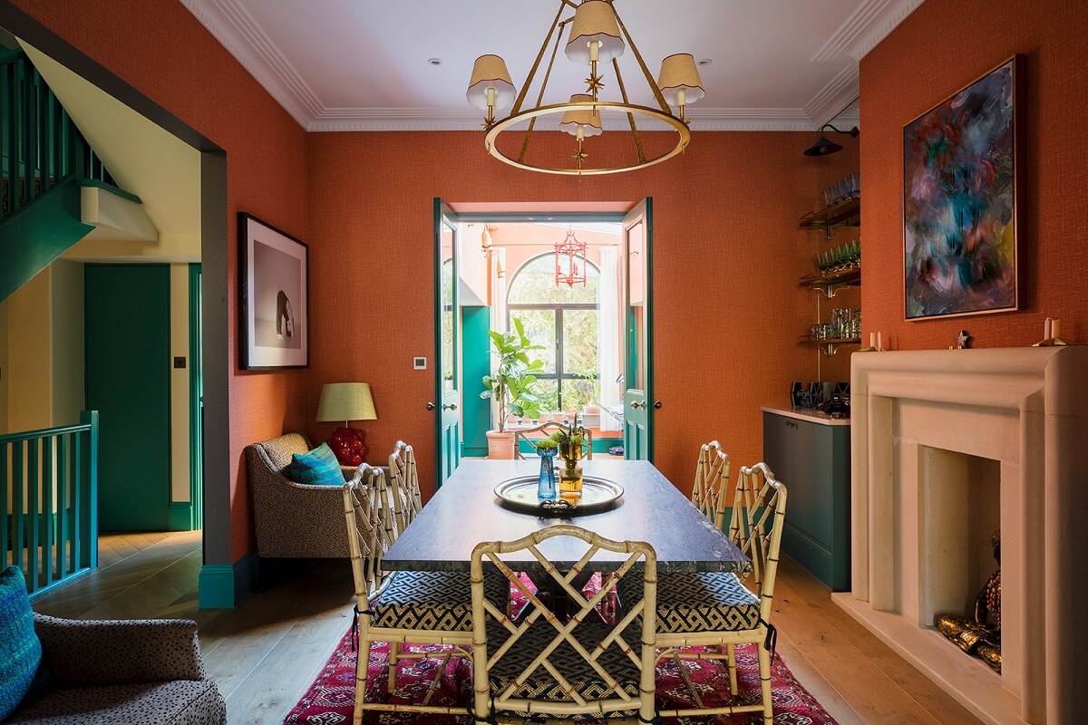 A Unique Colorful Family Home in London 3 dining-room-orange-wallpaper-fireplace-colorful-family-home-nordroom