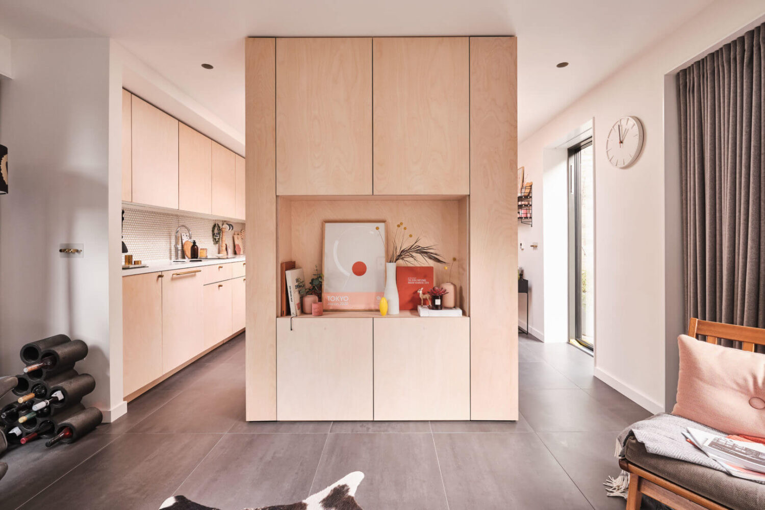 A Modern Award Winning House in London 8 dividing-wall-storage-open-plan-modern-home-nordroom