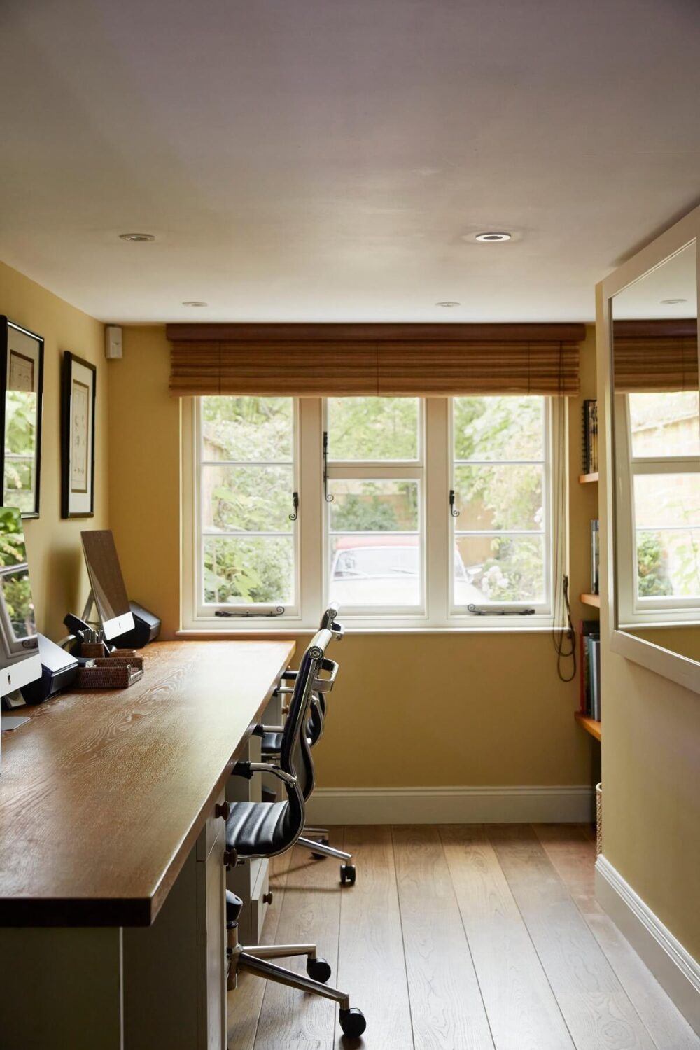 A Charming Arts and Crafts Cottage in the English Countryside 9 double-desk-home-office-yellow-walls-english-cottage-nordroom