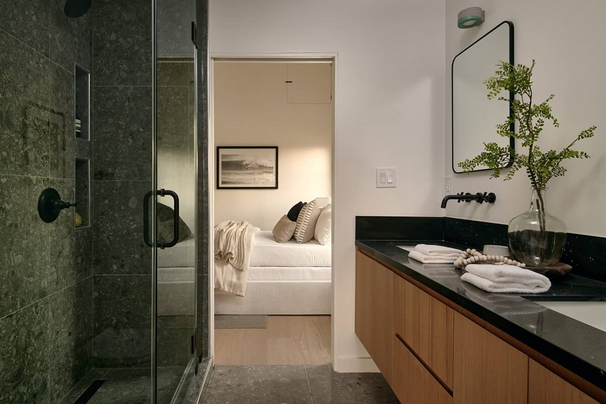A Stylish Los Angeles Bungalow Renovated by a Designer 18 en-suite-bathroom-shower-oak-vanity-nordroom