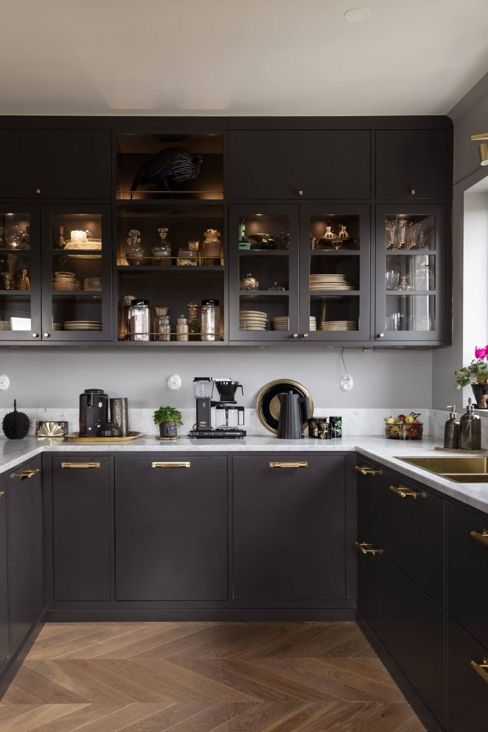 Herringbone vs. Chevron Flooring Patterns: Differences & Inspiration 30 gray-kitchen-brass-fixtures-nordroom