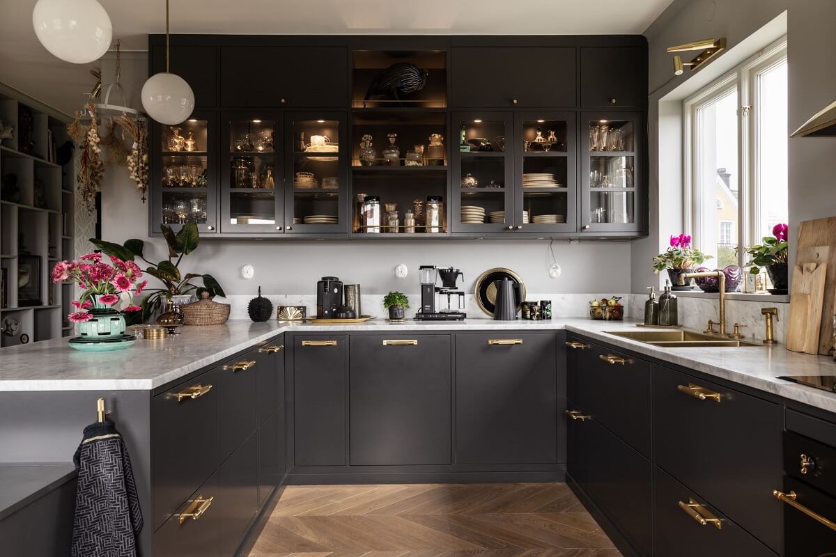 A Scandinavian Home with Purple Color Accents 13 gray-kitchen-glass-cabinets-wood-floor-nordroom