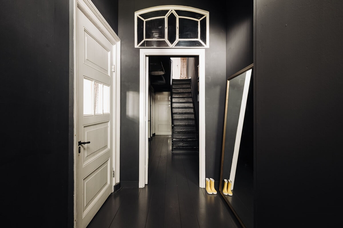 A Unique Black and White Home in a Former School Building 40 hallway-black-walls-black-floor-nordroom