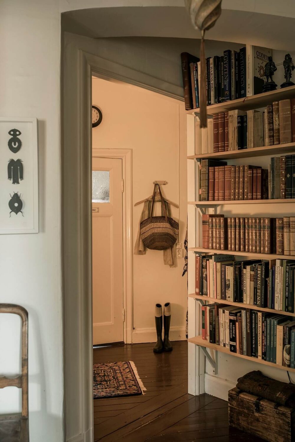 A Cozy Green Kitchen in a Vintage Attic Apartment 15 hallway-bookshelves-vintage-swedish-apartment-nordroom