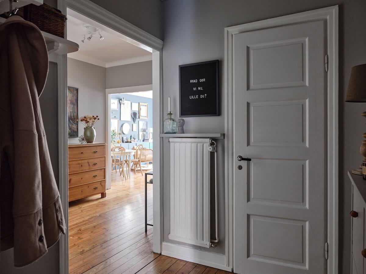 A Small Nordic Home with Dark Blue Accent Walls 17 hallway-light-gray-walls-nordroom