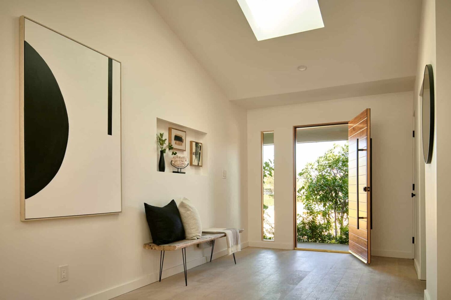 A Stylish Los Angeles Bungalow Renovated by a Designer 19 hallway-niche-bench-skylight-nordroom