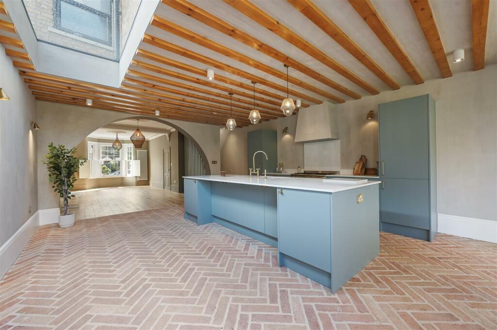 Herringbone vs. Chevron Flooring Patterns: Differences & Inspiration 16 herringbone brick floor in modern kitchen nordroom