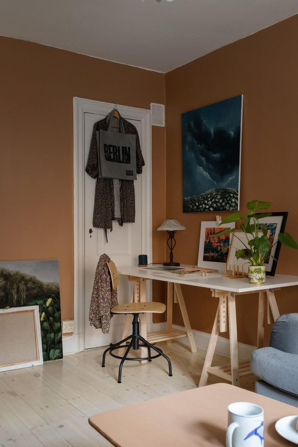 A Cozy Apartment Painted in Warm Natural Colors 6 home-office-art-ikea-table-warm-sitting-room-nordroom