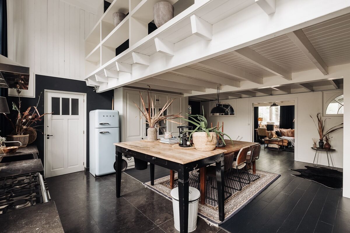 A Unique Black and White Home in a Former School Building 13 kitchen-dining-table-black-floor-loft-space-nordroom
