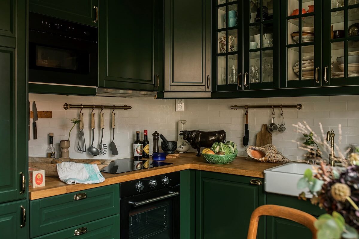 A Cozy Green Kitchen in a Vintage Attic Apartment 4 kitchen-green-cupboards-glass-upper-cabinets-nordroom