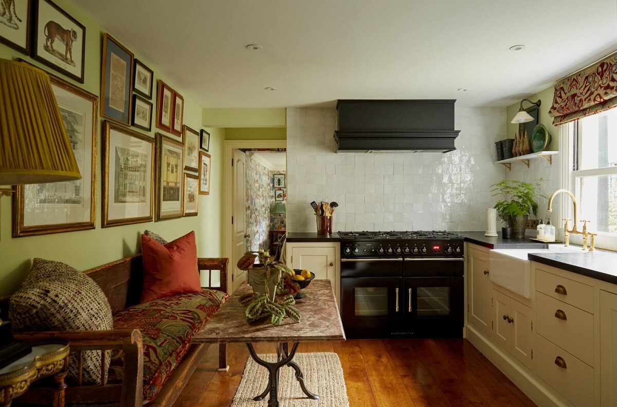 A Charming Antique Apartment in London with a Garden 8 kitchen-green-ground-farrow-ball-dining-table-bench-gallery-wall-nordroom