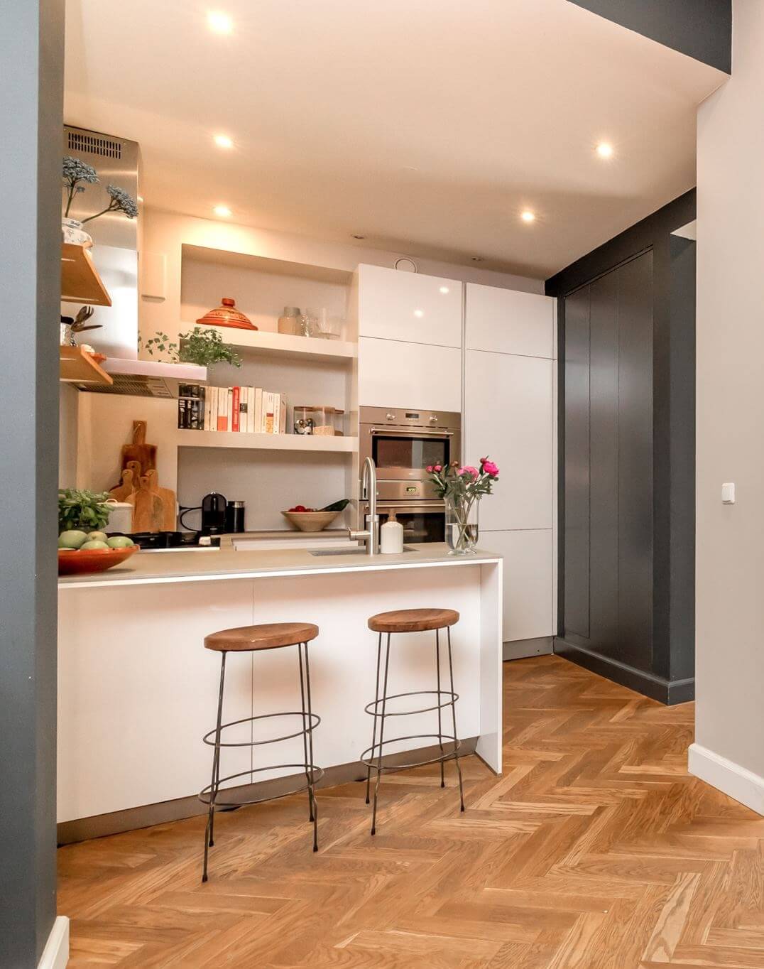 Herringbone vs. Chevron Flooring Patterns: Differences & Inspiration 3 kitchen-herringbone-floor-white-cabinets-nordroom