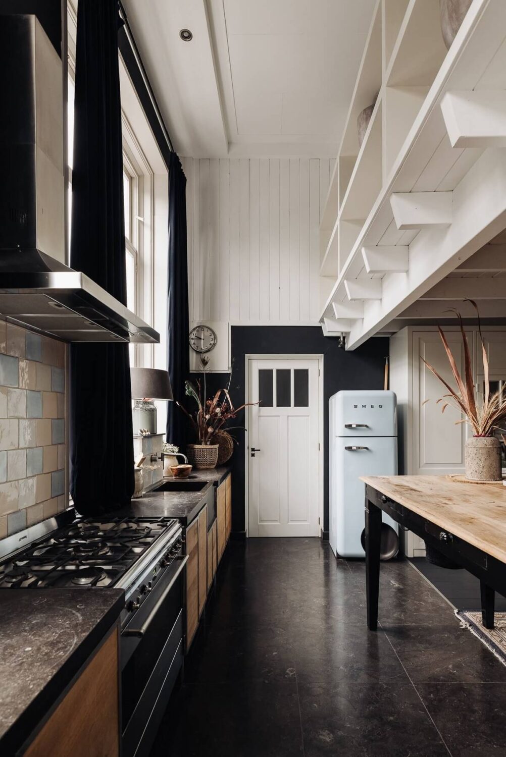 A Unique Black and White Home in a Former School Building 12 kitchen-high-ceiling-black-floor-nordroom