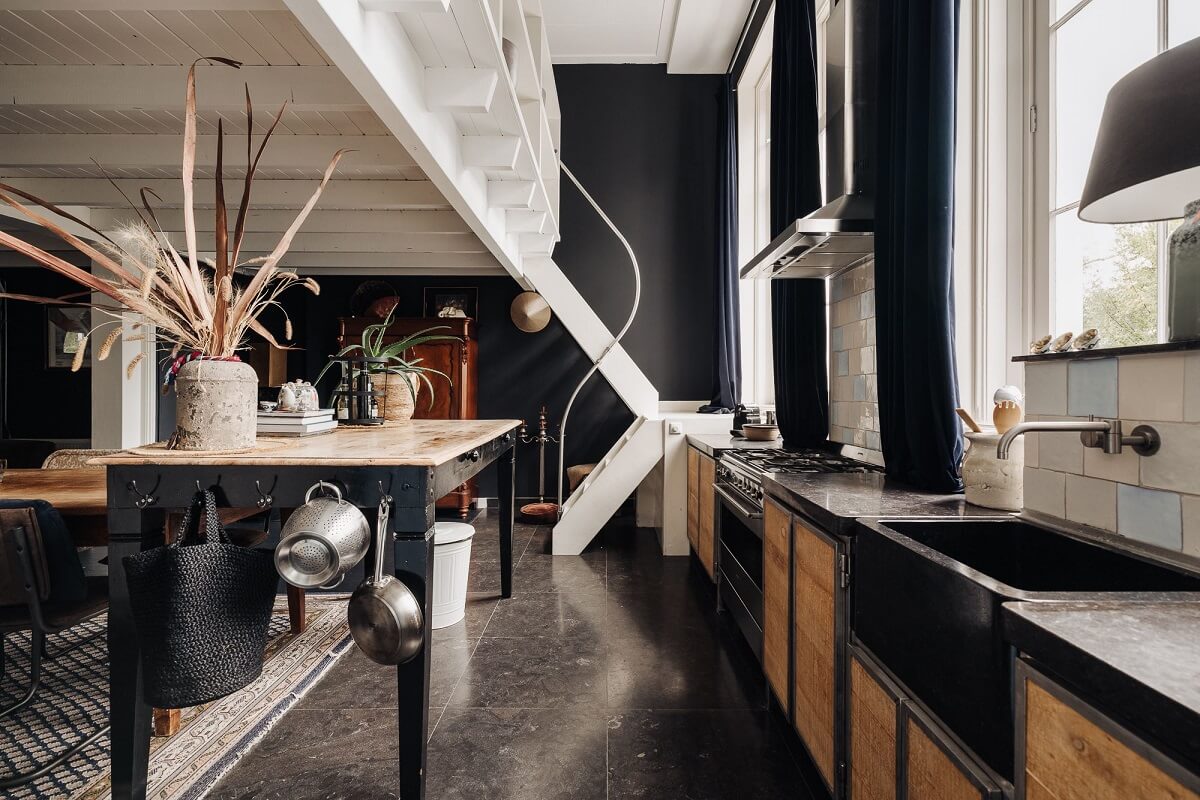 A Unique Black and White Home in a Former School Building 11 kitchen-loft-space-black-walls-nordroom