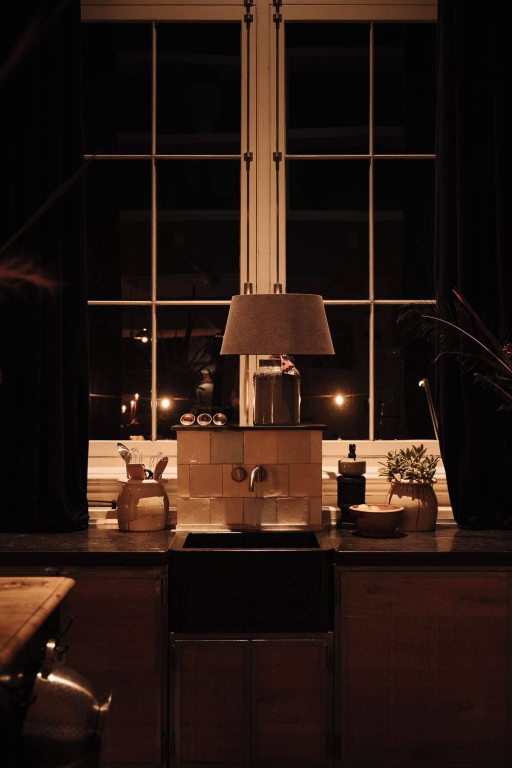 A Unique Black and White Home in a Former School Building 14 kitchen-sink-at-night-townhouse-nordroom