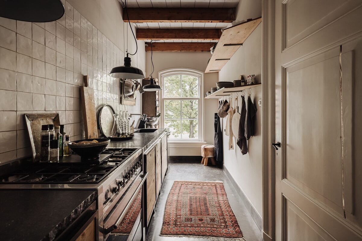 A Unique Black and White Home in a Former School Building 33 kitchen-white-tiles-dutch-townhouse-nordroom