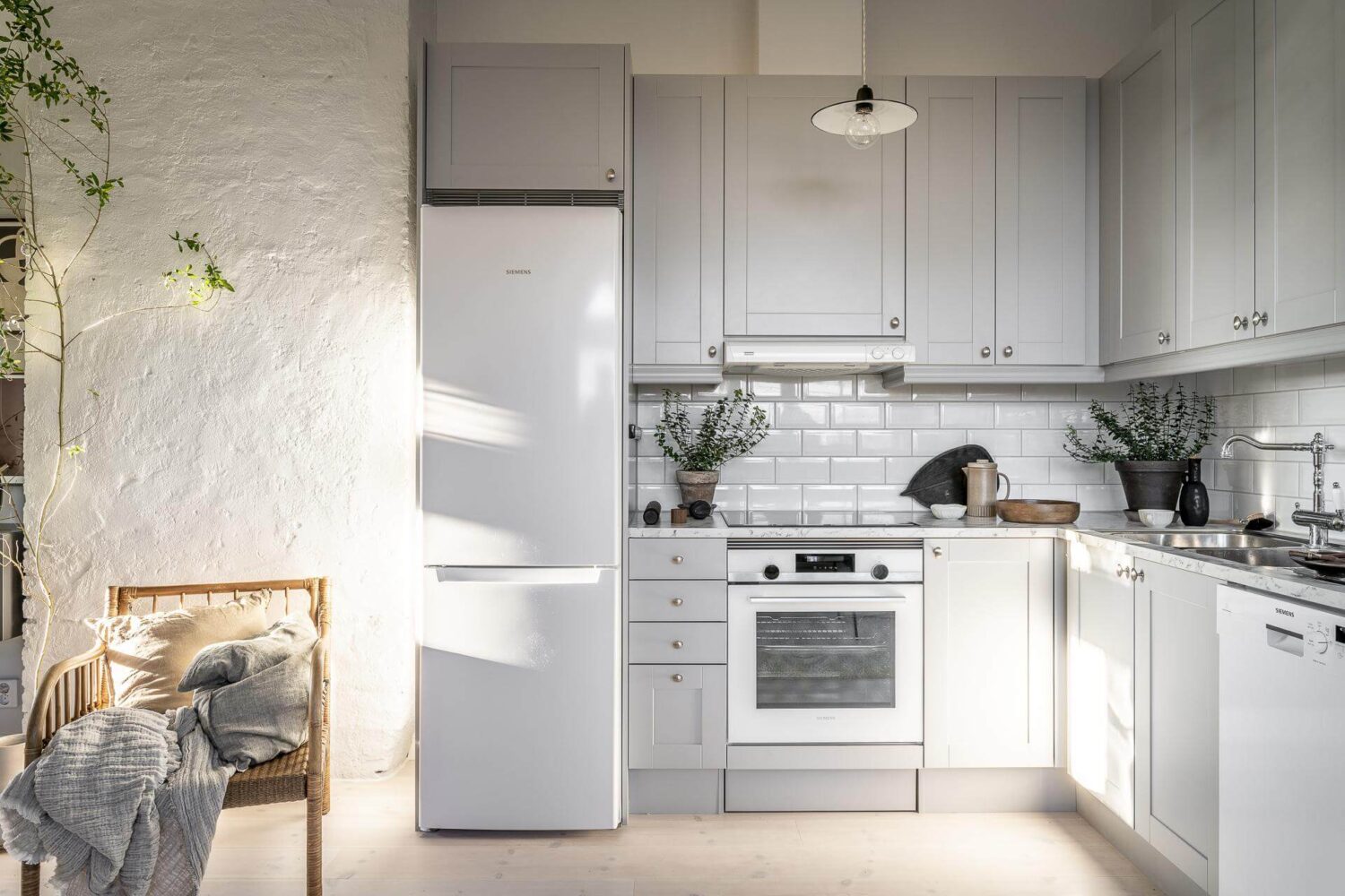A Small Scandinavian Loft with Beautiful Natural Light 5 light-gray-kitchen-cabinets-nordic-loft-nordroom