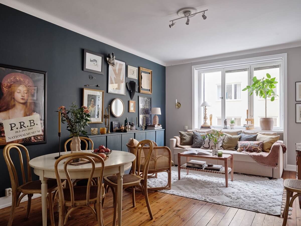 A Small Nordic Home with Dark Blue Accent Walls 1 living-room-dark-blue-accent-wall-ikea-ivar-cabnets-round-dining-table-nordroom