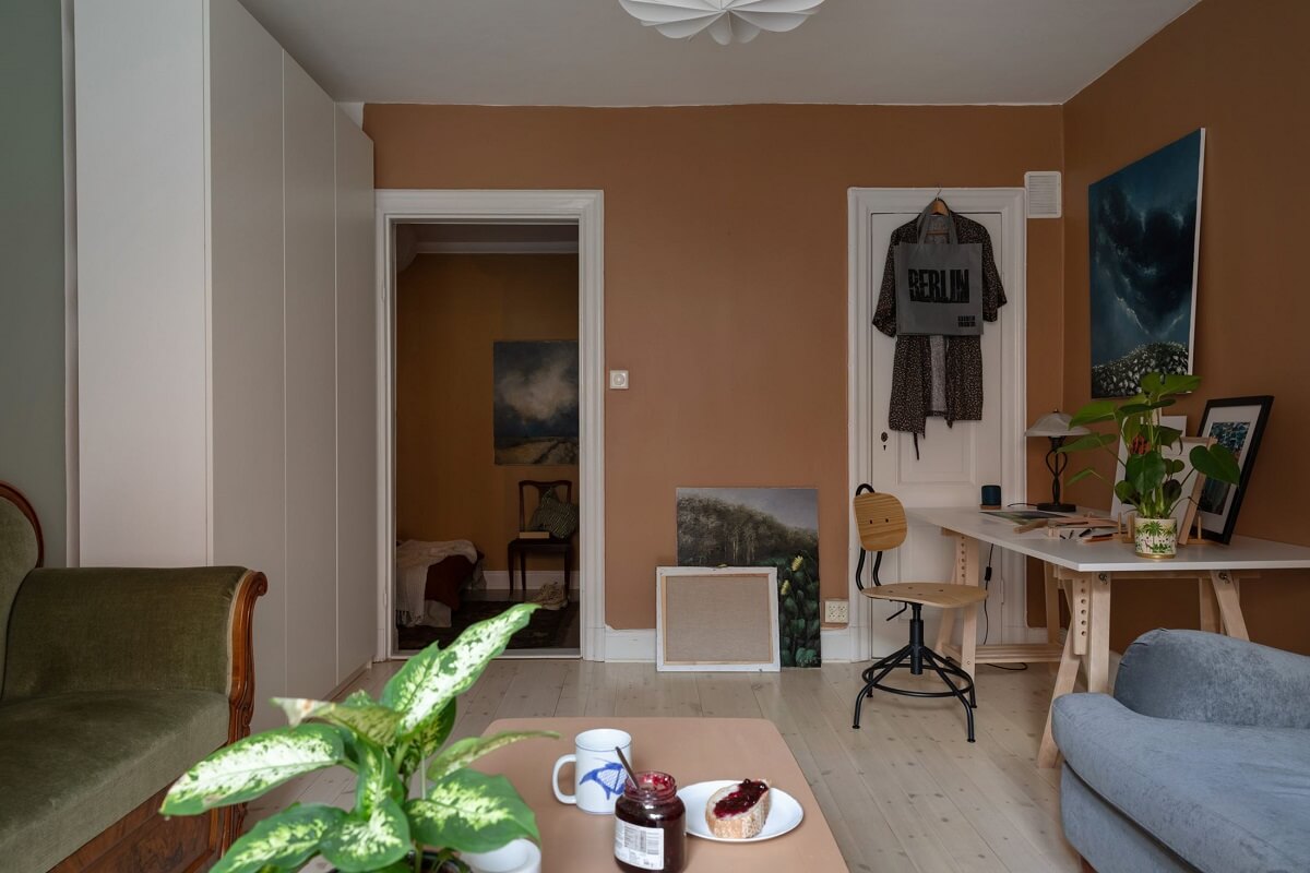 A Cozy Apartment Painted in Warm Natural Colors 5 living-room-earth-color-walls-home-office-nordroom