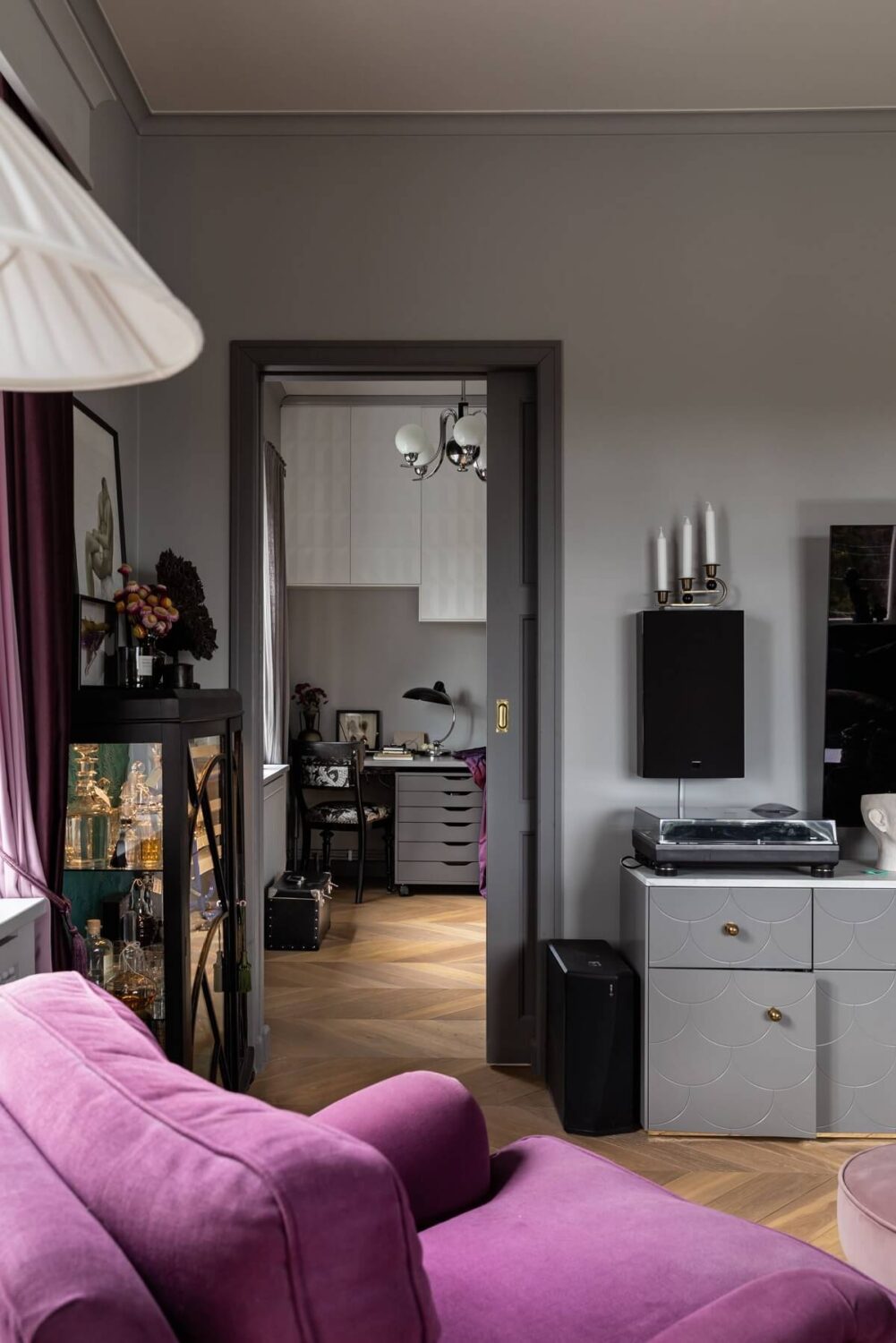 A Scandinavian Home with Purple Color Accents 19 living-room-gray-walls-purple-armchair-nordroom