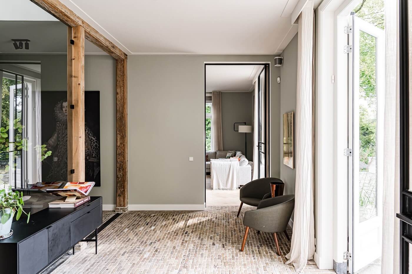 A Luxurious Dutch Villa in a Former Carriage House 7 living-room-stone-floor-exposed-beams-nordroom
