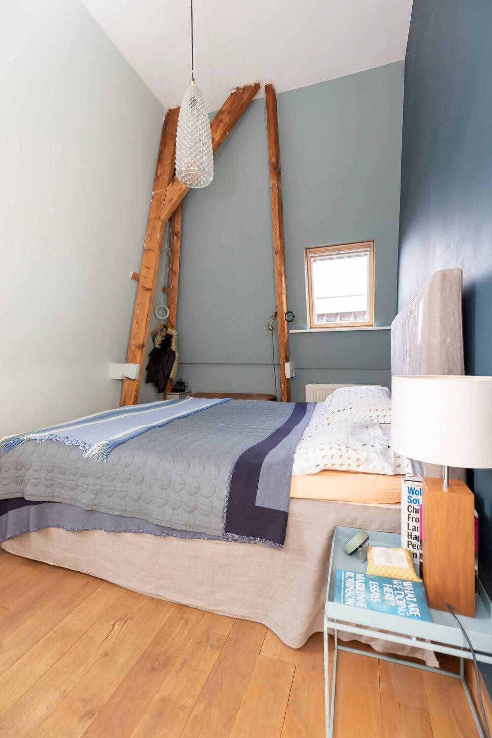 A Colorful Loft in Amsterdam with Exposed Wooden Beams 22 loft-bedroom-blue-walls-nordroom