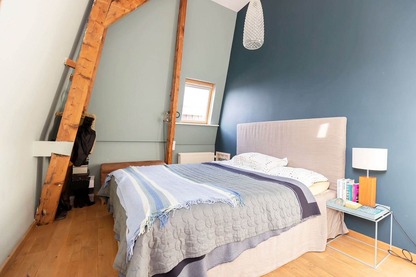 A Colorful Loft in Amsterdam with Exposed Wooden Beams 21 loft-bedroom-two-tone-blue-walls-nordroom