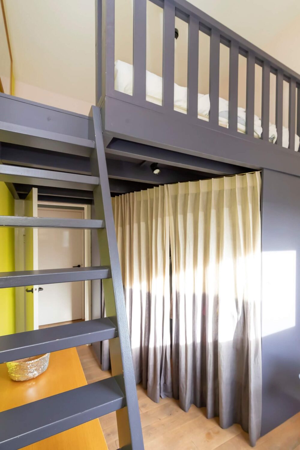 A Colorful Loft in Amsterdam with Exposed Wooden Beams 20 loft-closet-curtain-colorful-loft-nordroom