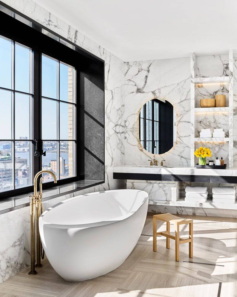 Trevor Noah Sells His Manhattan Penthouse with Roof Terrace 18 marble-master-bathroom-freestanding-bath-nordroom