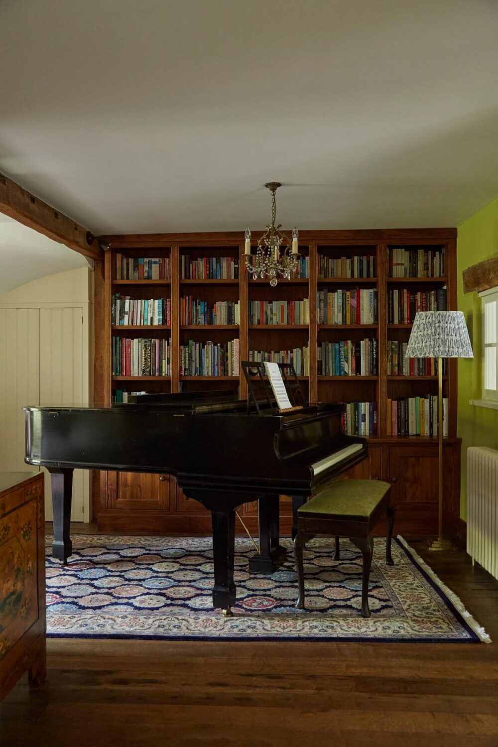 A Charming Arts and Crafts Cottage in the English Countryside 5 music-room-built-in-bookshelves-piano-wooden-floor-english-cottage-nordroom