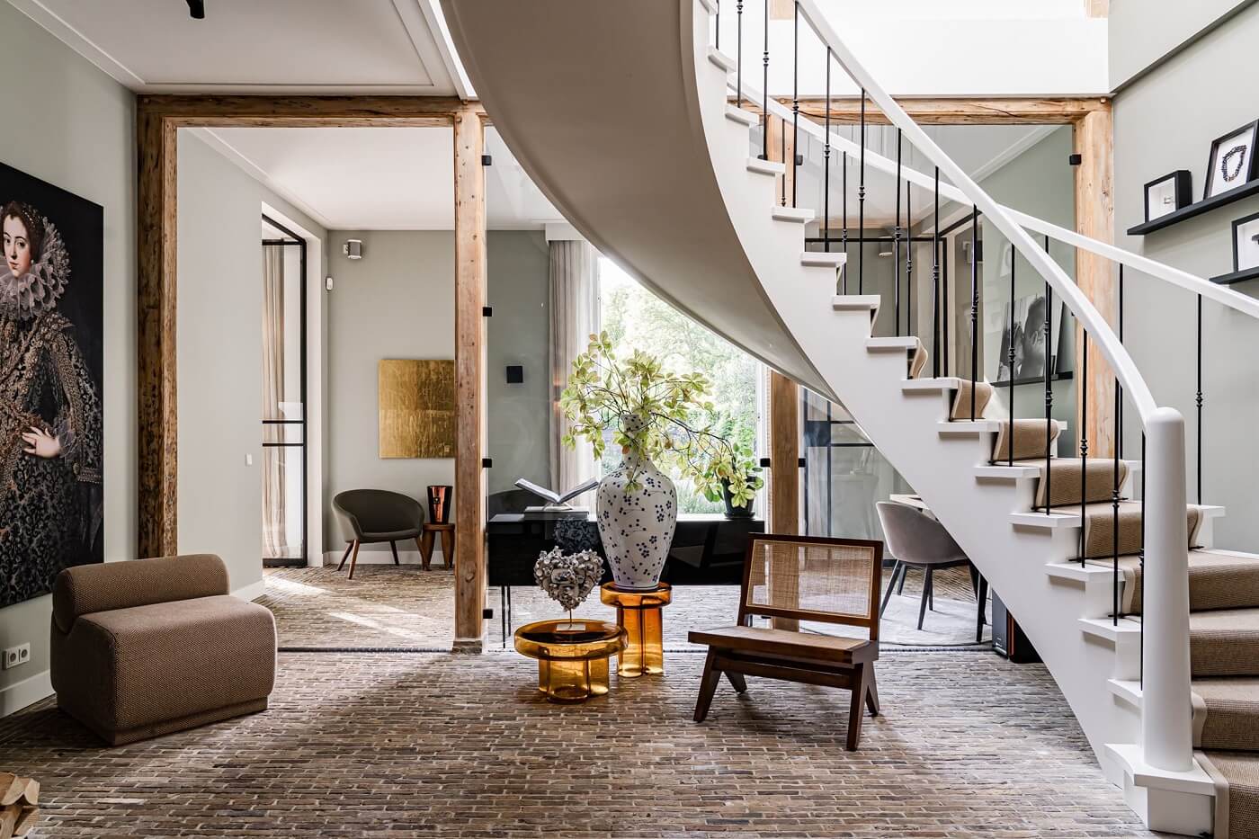 A Luxurious Dutch Villa in a Former Carriage House 3 open-plan-living-foyer-winding-staircase-brick-floor-nordroom
