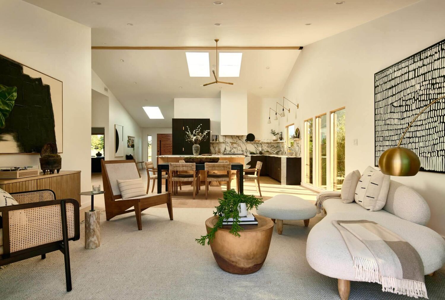 A Stylish Los Angeles Bungalow Renovated by a Designer 4 open-plan-living-room-kitchen-rounded-couch-nordroom
