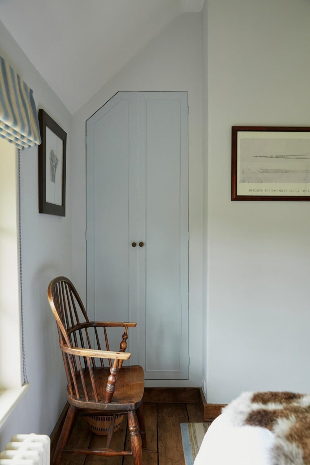 A Charming Arts and Crafts Cottage in the English Countryside 11 pale-blue-bedroom-raw-wooden-floorboards-built-in-closet-nordroom
