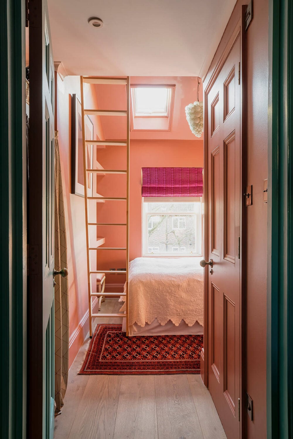 A Unique Colorful Family Home in London 10 pink-bedroom-loft-space-built-in-closets-nordroom