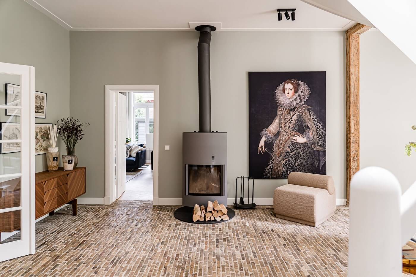 A Luxurious Dutch Villa in a Former Carriage House 4 sitting-room-brick-floor-fireplace-nordroom