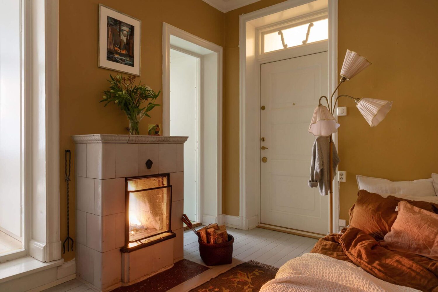 A Cozy Apartment Painted in Warm Natural Colors 8 small-bedroom-fireplace-warm-natural-colors-nordroom