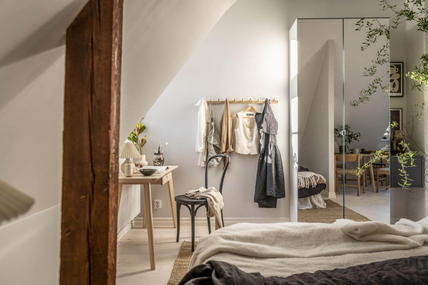 A Small Scandinavian Loft with Beautiful Natural Light 12 small-scandinavian-loft-mirror-wardrobe-exposed-beams-nordroom