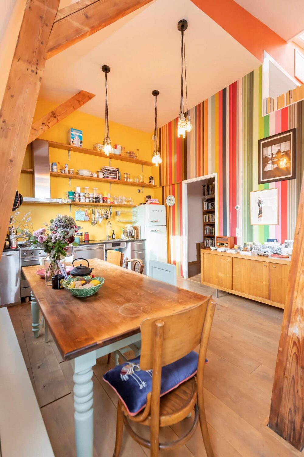 A Colorful Loft in Amsterdam with Exposed Wooden Beams 11 striped-wall-dining-area-kitchen-colorful-loft-nordroom