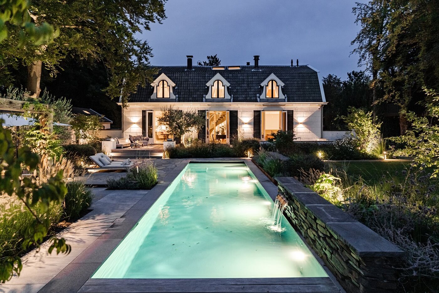 A Luxurious Dutch Villa in a Former Carriage House 34 swimmnig-pool-exterior-garden-at-night-nordroom