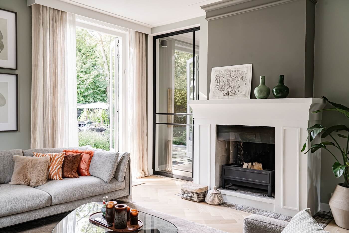A Luxurious Dutch Villa in a Former Carriage House 9 white-fireplace-living-room-gray-walls-nordroom