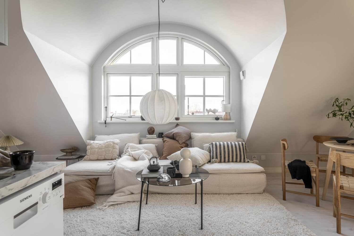A Small Scandinavian Loft with Beautiful Natural Light 3 white-sofa-seating-area-loft-natural-light-nordroom