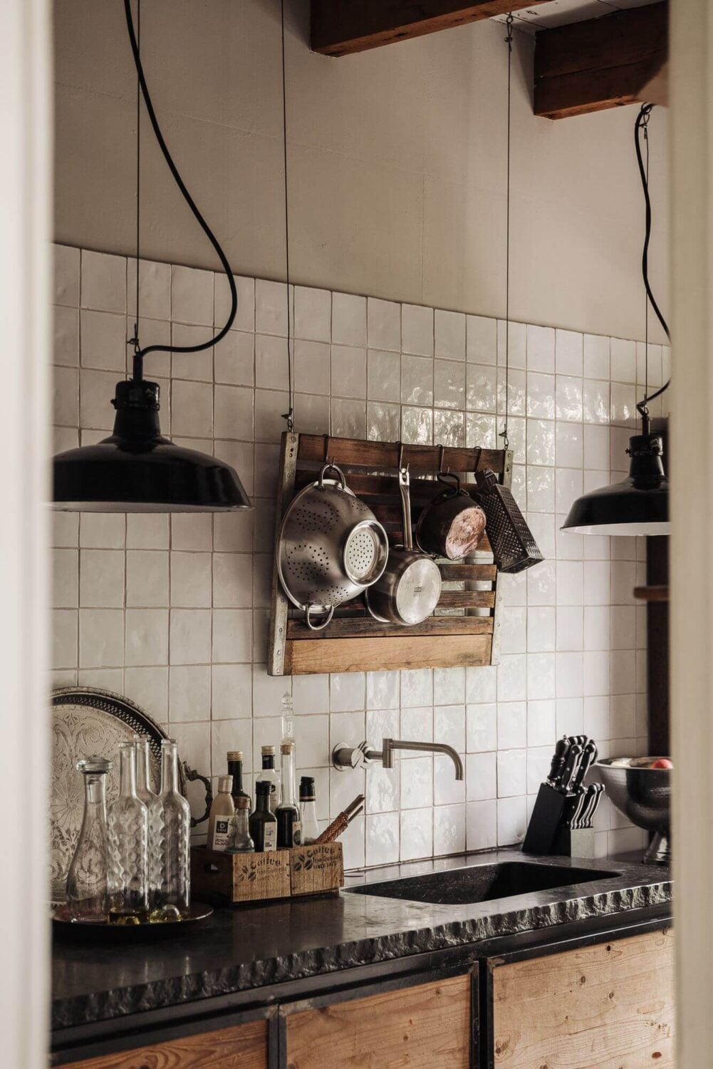 A Unique Black and White Home in a Former School Building 34 white-tiles-kitchen-exposed-beams-nordroom