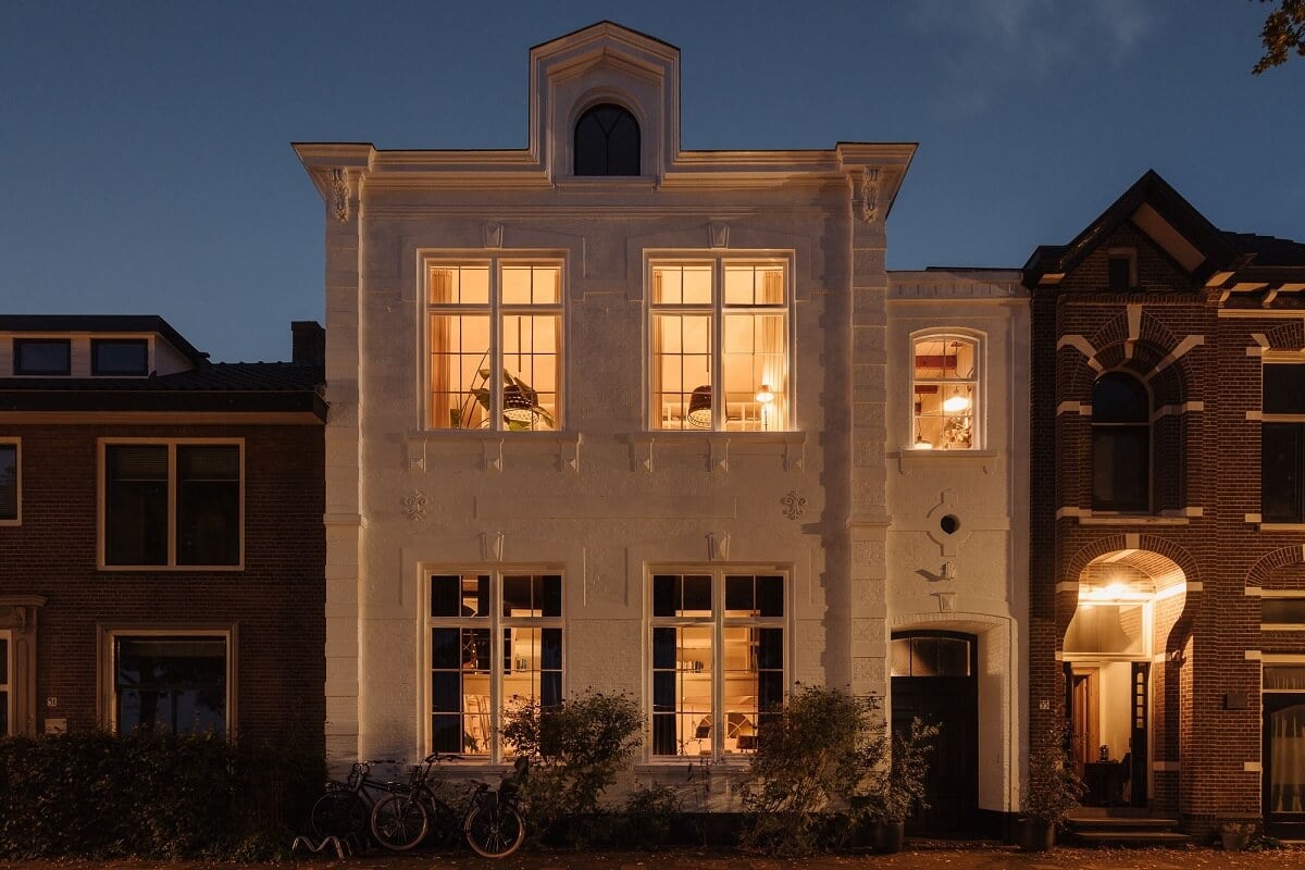 A Unique Black and White Home in a Former School Building 48 white-townhouse-at-night-netherlands-nordroom