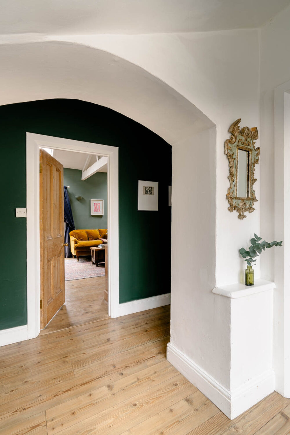 An English Barn Conversion Decorated in Green and Blue 8 arched-hallway-green-walls-barn-conversion-nordroom