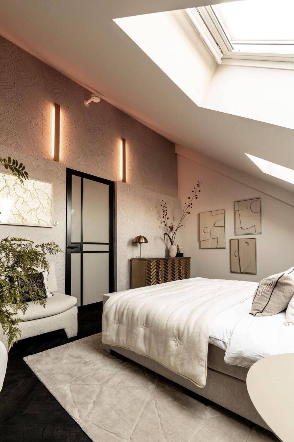 A Stylish Monochrome Penthouse in a Former Prison Building 20 attic-bedroom-slanted-ceiling-skylights-black-chevron-floor-nordroom