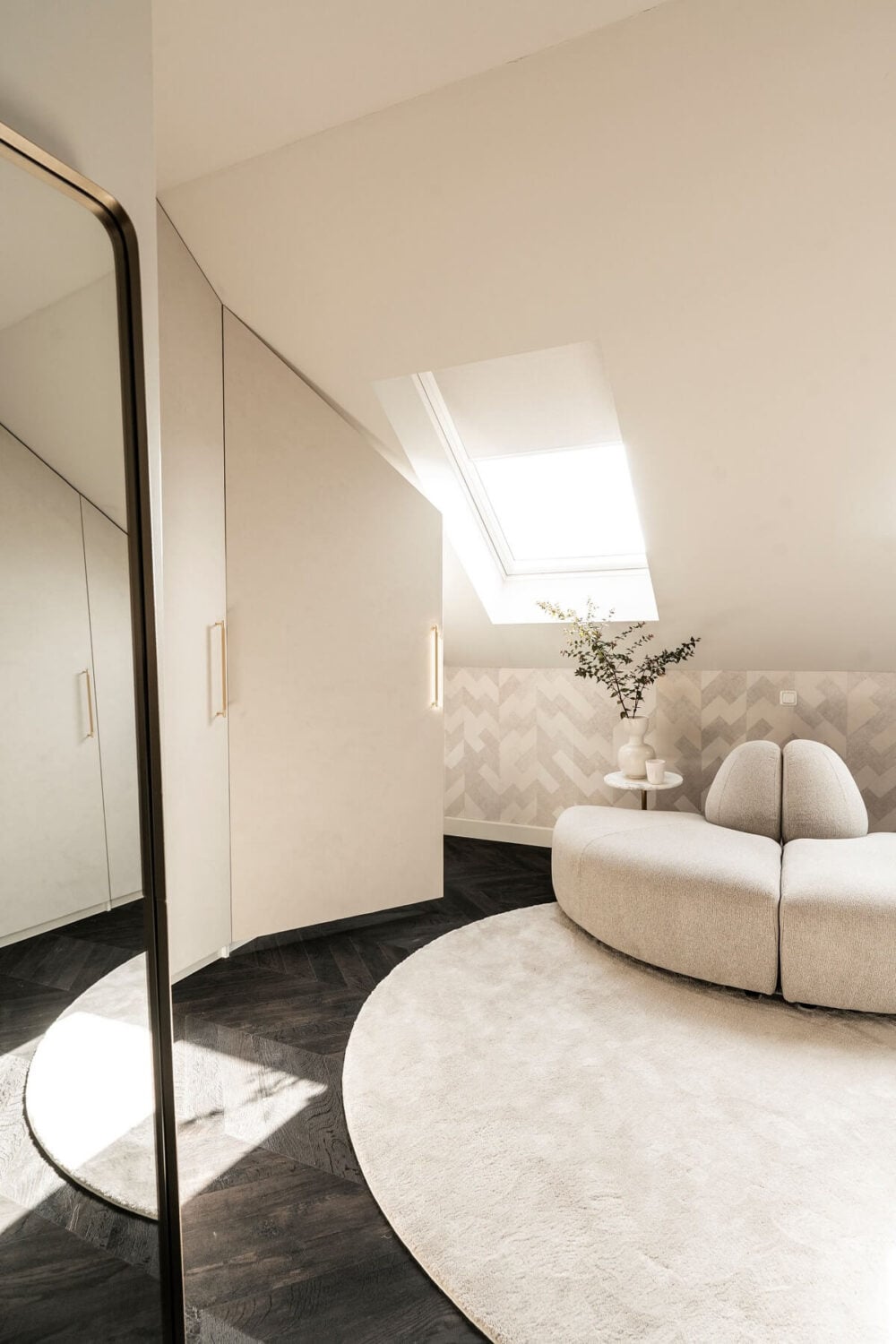 A Stylish Monochrome Penthouse in a Former Prison Building 23 attic-walk-in-closet-round-rug-sofa-nordroom