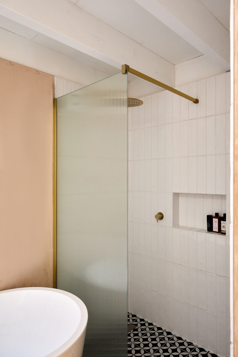 A London Home with Plaster Pink Walls and Brick Chimneys 16 bathroom-shower-frosted-glass-wall-brass-fixtures-nordroom